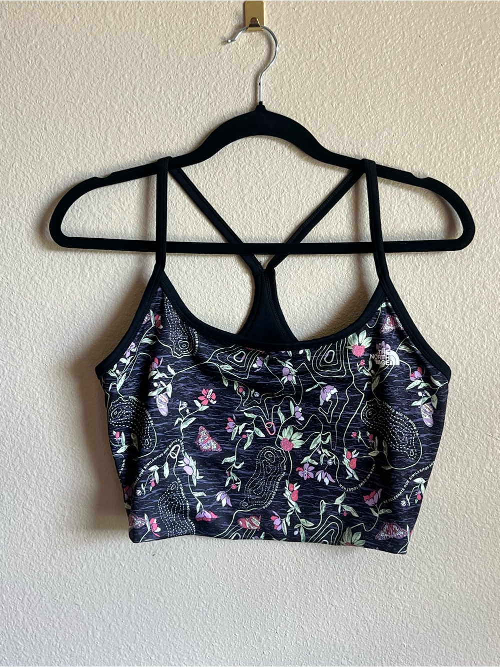 Bundle The North Face Floral Black Strappy Sports Bra with matching shorts.